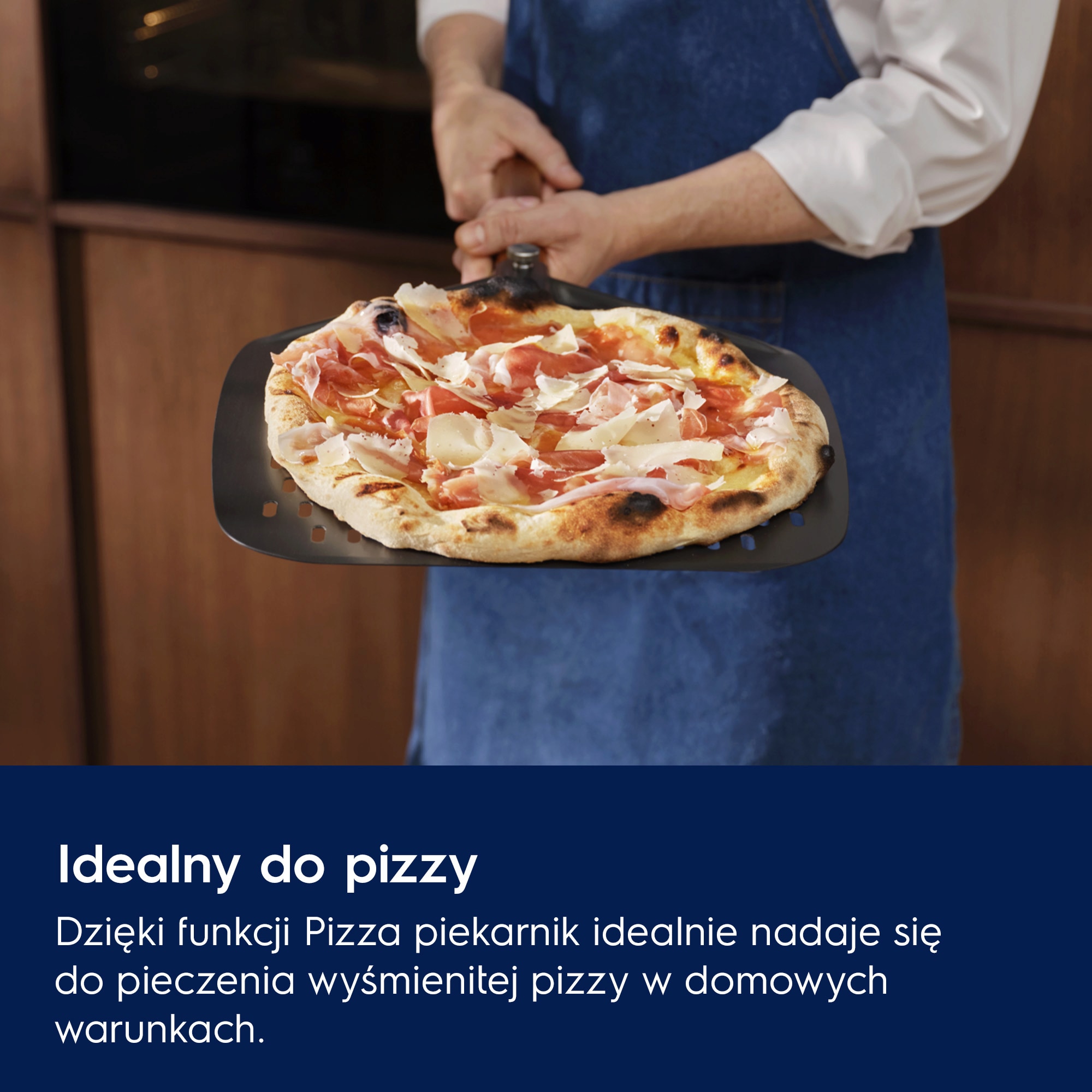 Open oven with a freshly baked pizza topped with pepperoni, mushrooms, and melted cheese on the top